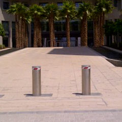 fixed bollards positioned in front of a university to prevent unauthorized access