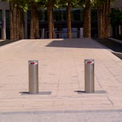 photo of stainless steel automatic bollards with brushless motor installed at a university as protection against possibile attacks