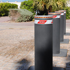 removable bollard image with LED light strip positioned at the entrance of a sensitive area to protect safety of people