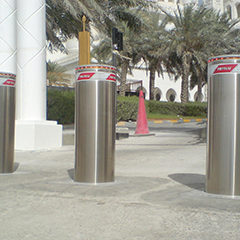 image stainless steel semiautomatic bollards with flashing light positioned at the entrance to a religious place