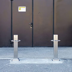 photograph of removable bollards installed at the entrance of a commercial warehouse