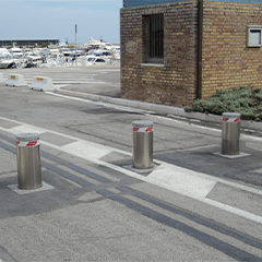 image of automatic reinforced bollards installed at the entrance of a port to prevent the entry of unauthorized personnel