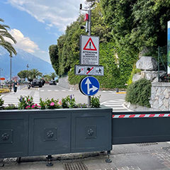image of a mobile barrier with traffic light positioned to signal a pedestrian area