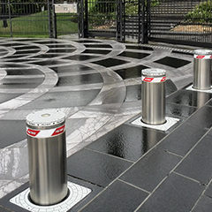 image of stainless steel bollards with automatic movement used as protection for a private home
